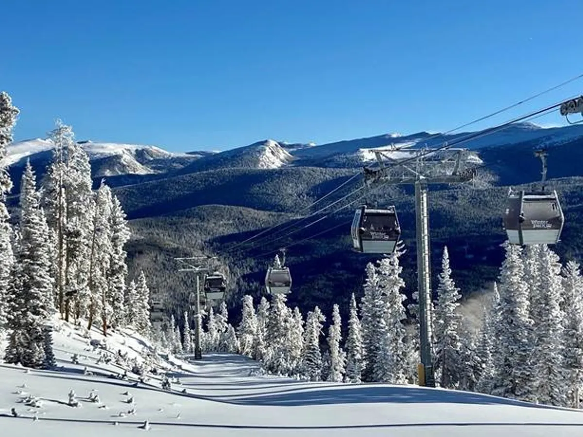 A vibrant winter scene featuring ski lifts ascending snowy slopes, with mountains and pine trees in the background. The atmosphere is energetic yet serene, reflecting the thrill of mountain adventures followed by cozy gatherings.